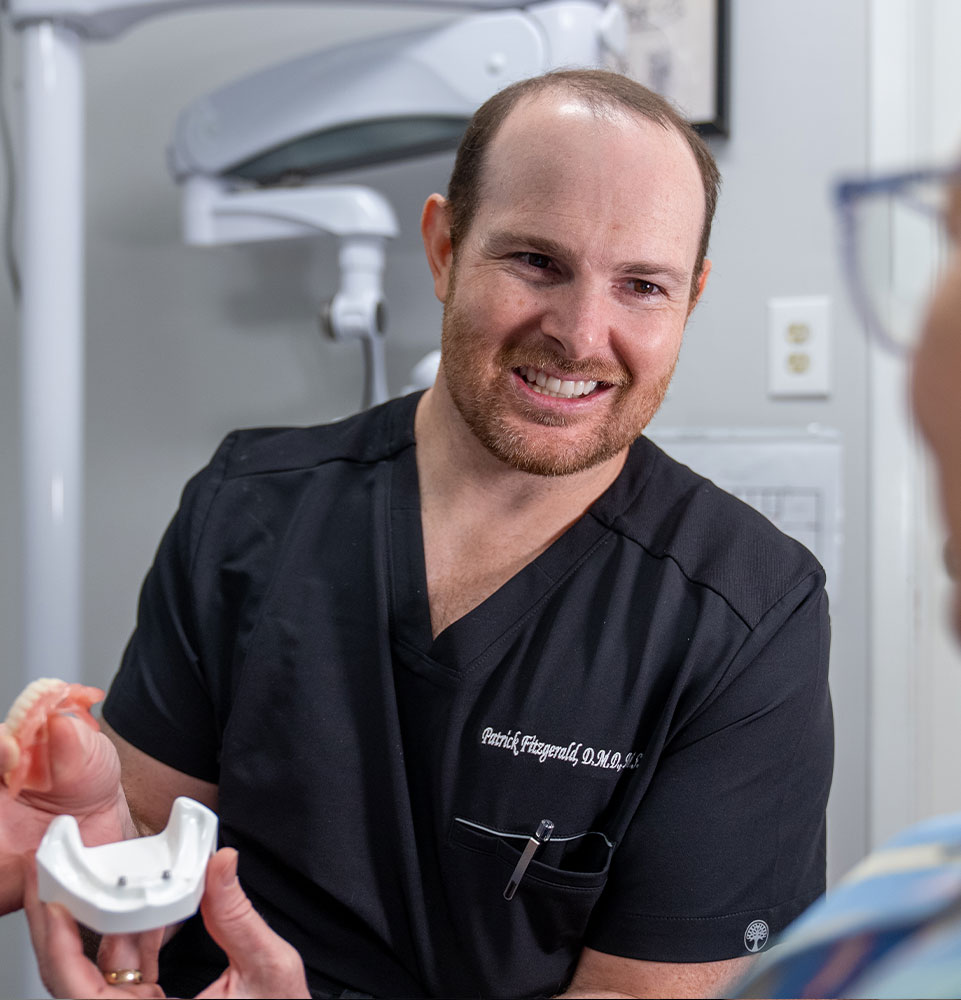 doctor going over dental procedure information