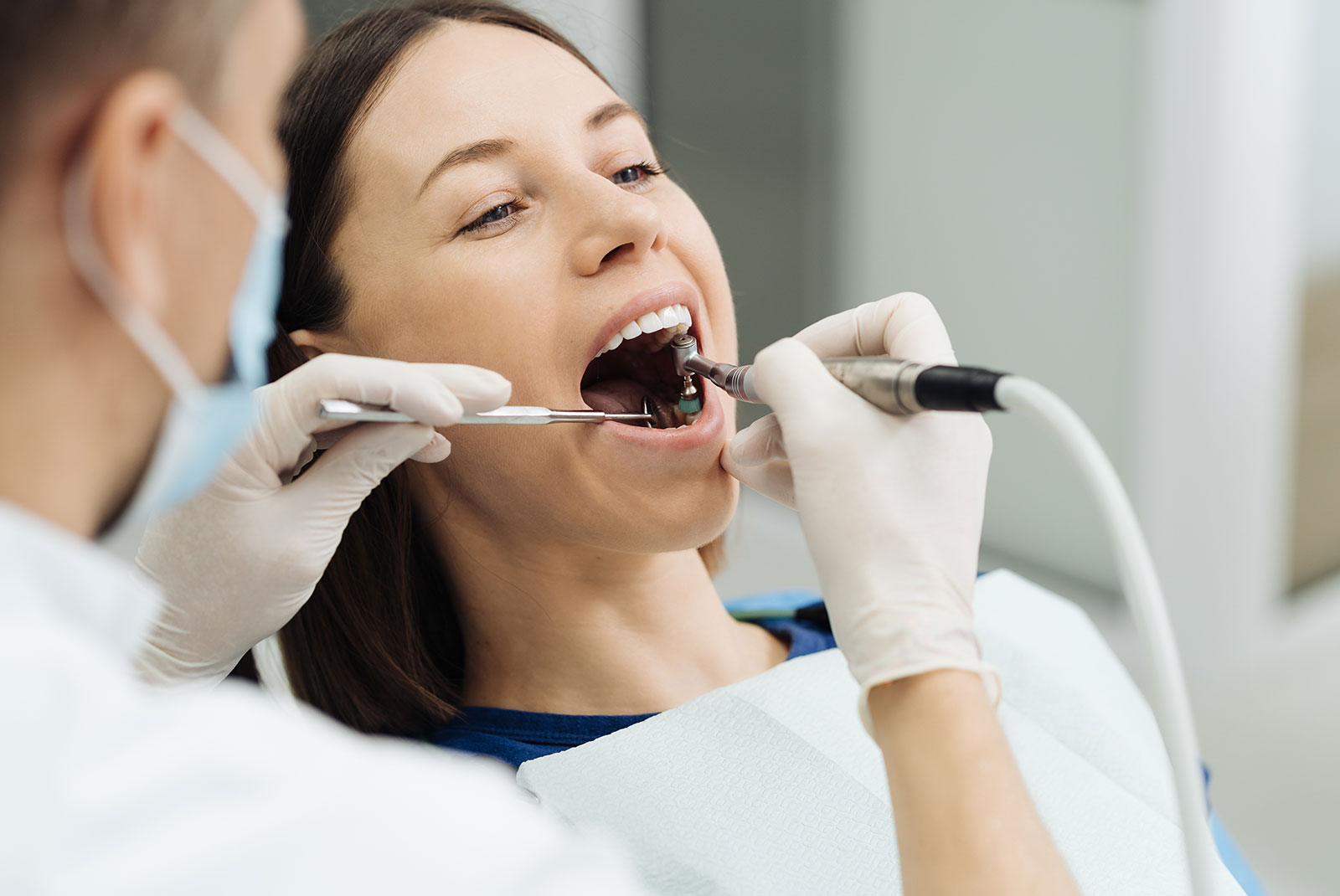 Dental specialist performing endodontic retreatment