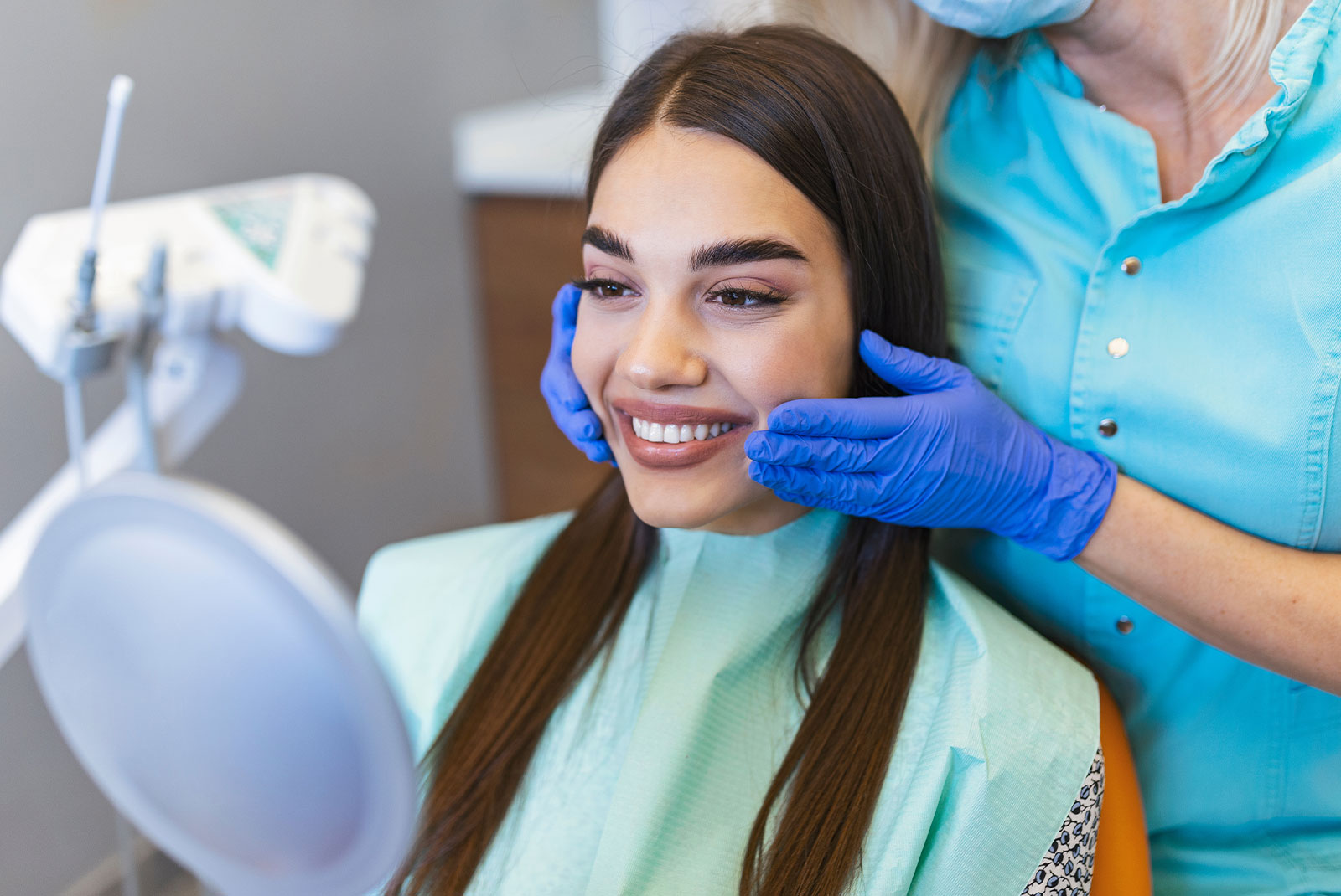 Dental specialist smiling with instruments