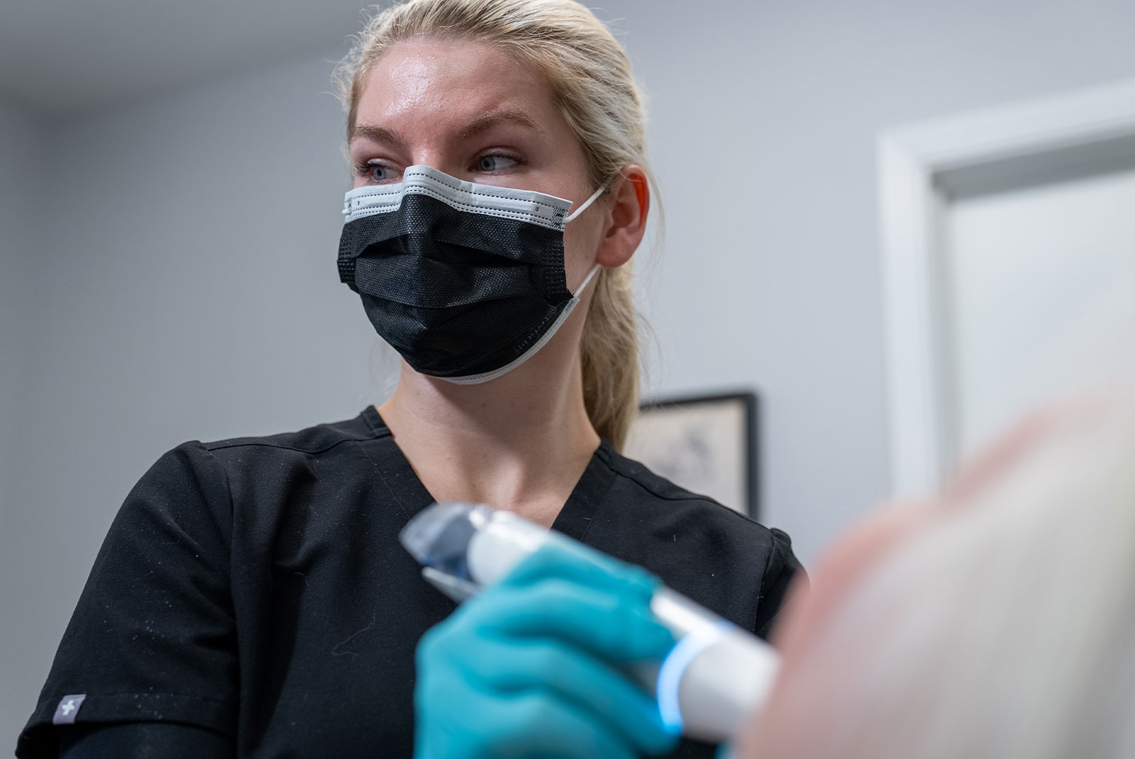 Dental specialist holding tools and smiling