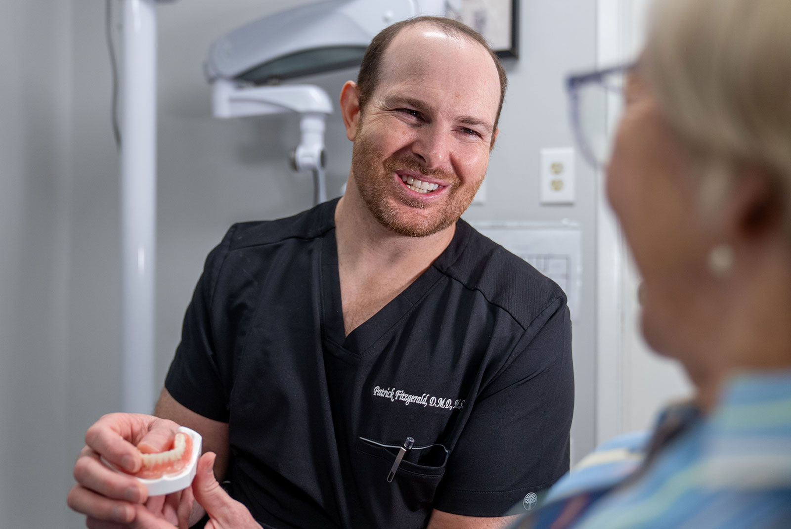 Dental specialist smiling with instruments