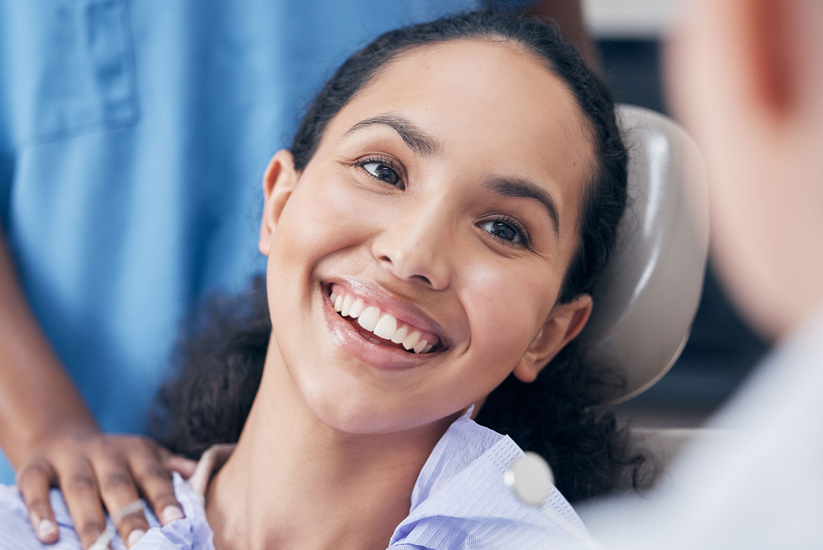 Dental specialist smiling with tools