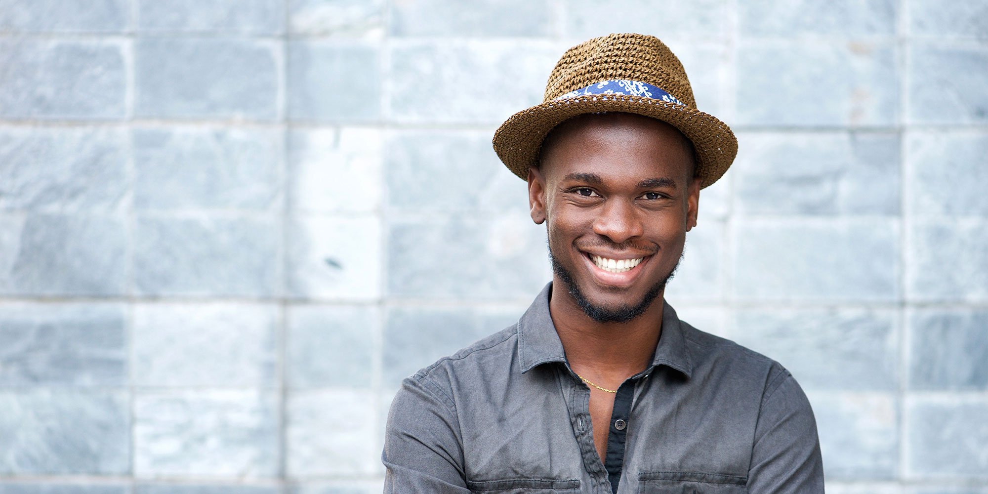 headshot of male model smiling brightly for their photoshoot